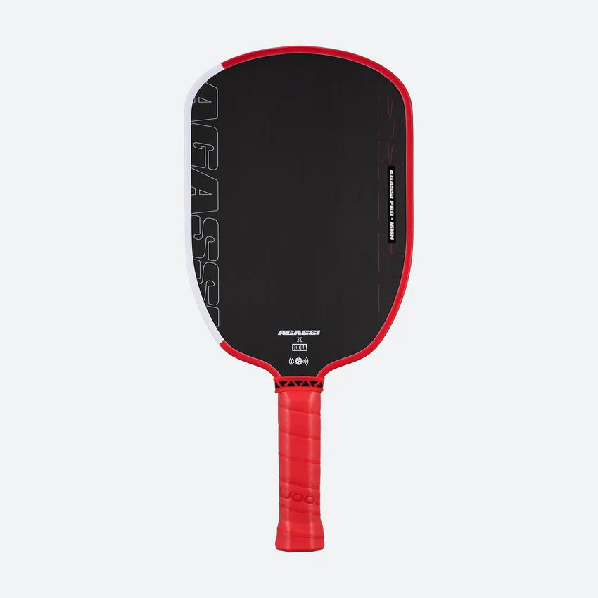 Black and red pickleball paddle on a light gray background