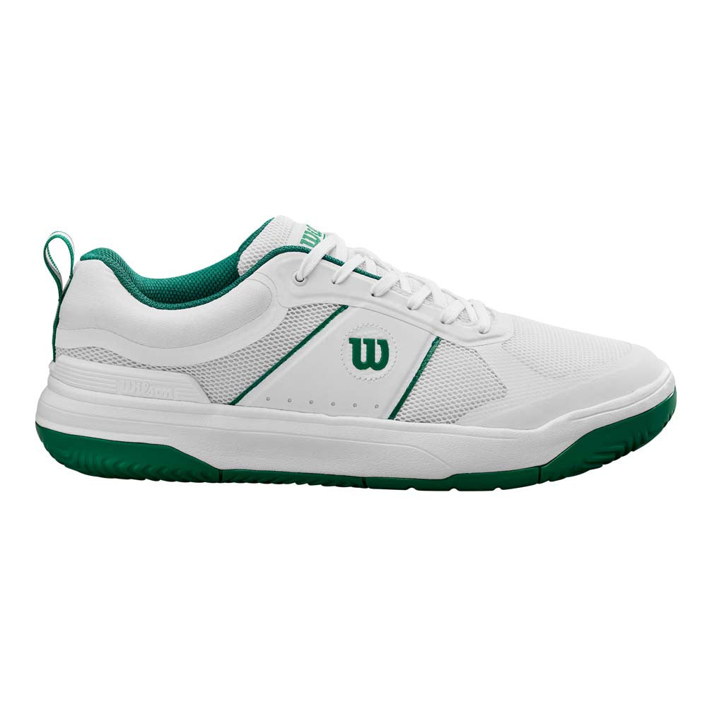 White and green tennis shoe with Wilson logo on a white background